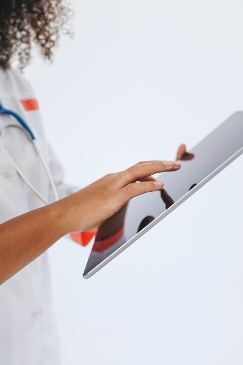 A Doctor using Tablet
