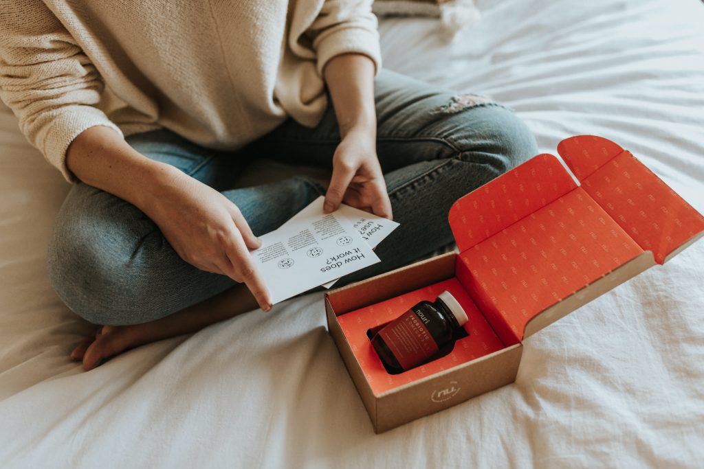 Woman sitting on bed