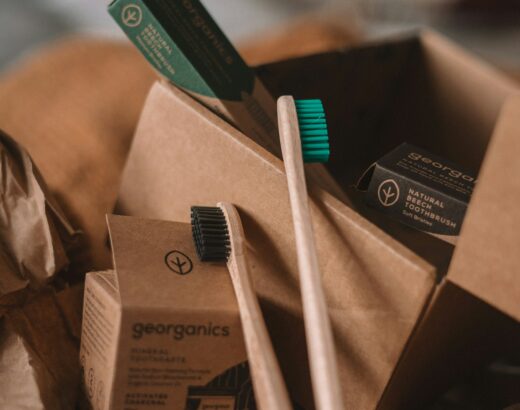 green and white toothbrush on brown carton box