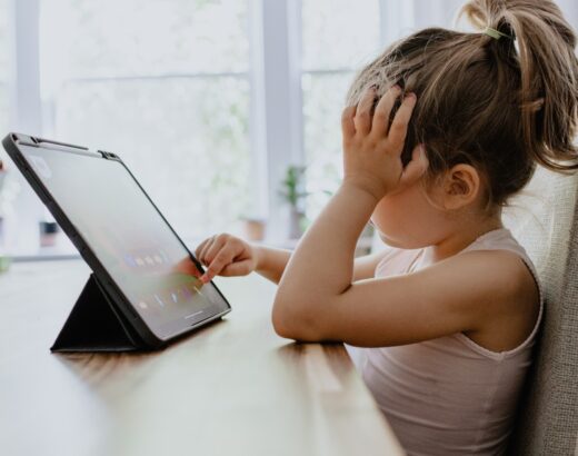 young girl using ipad