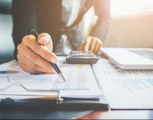 Man with pen budgeting