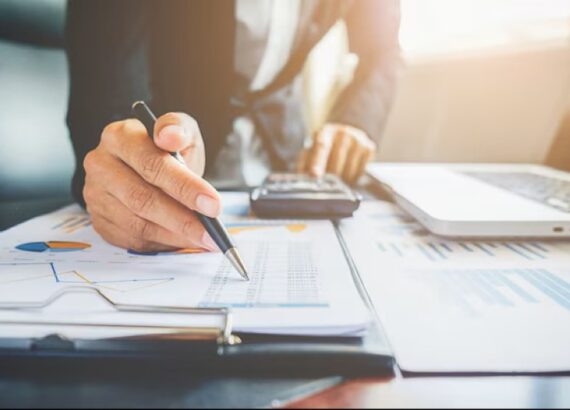 Man with pen budgeting