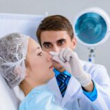 Plastic surgeon preparing for a rhinoplasty.